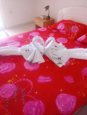 a bed with two hearts and jewelry on it at Asko Villa Apartment in Ulcinj
