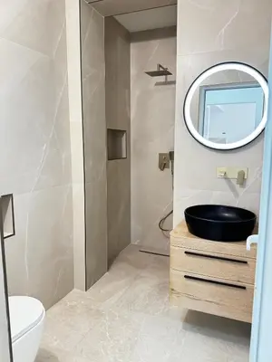 a bathroom with a sink and a mirror at Apartments Lj in Ulcinj