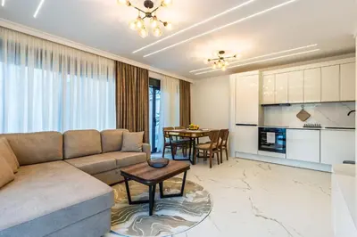 a living room with a couch and a table at Lux Apartments Villa B-L-S in Budva