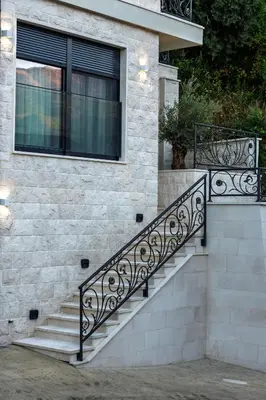 a set of stairs on a house with a window at Lux Apartments Villa B-L-S in Budva