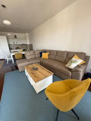 a living room with a couch and a coffee table at Sargo Apartman Bar in Bar