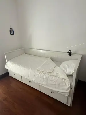 a white bed with white sheets and pillows on it at Sargo Apartman Bar in Bar