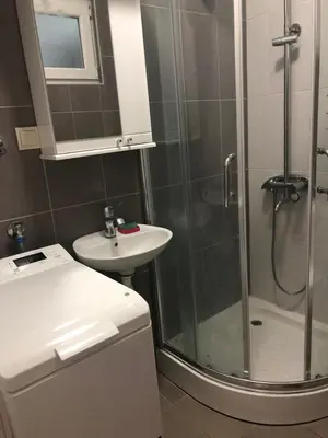 a bathroom with a shower and a sink at Studio Budva in Budva