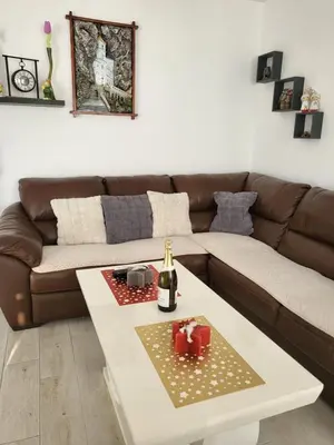 a living room with a couch and a white coffee table at Sunset Vista Kotor in Kotor