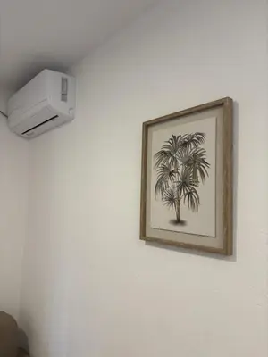 a picture of a palm tree on a wall at Bloom Home Bar in Bar