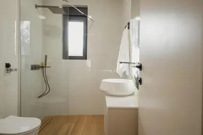 a bathroom with a toilet and a sink and a shower at Villa Teona KotorBay Residence in Kotor