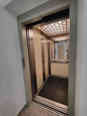 a hallway with a glass door in a building at Rafailovići Hill in Budva