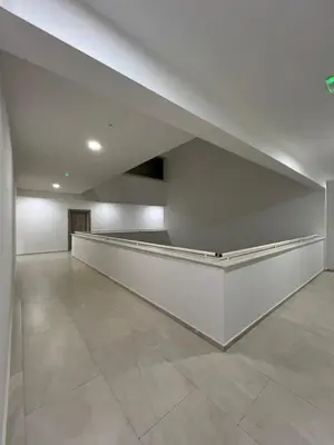 an empty room with white walls and tile floors at FAB LIFE Becici in Becici