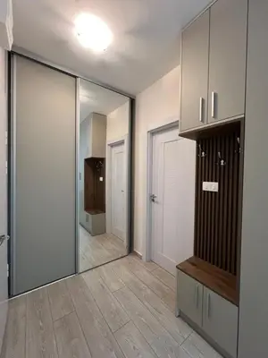 a room with a mirror and a door with a hallway at FAB LIFE Becici in Becici