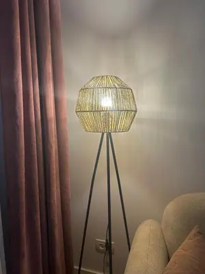 a lamp in a room next to a curtain at Apartment Lule in Bar