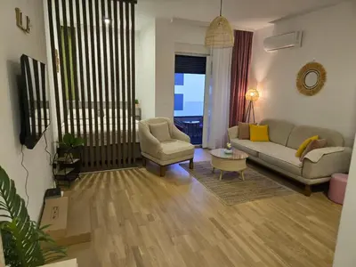 a living room with a couch and a chair at Apartment Lule in Bar