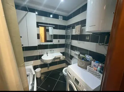 a small bathroom with a sink and a toilet at Kraljev park in Podgorica