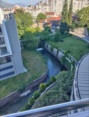 a view of a river from a building at Kraljev park in Podgorica