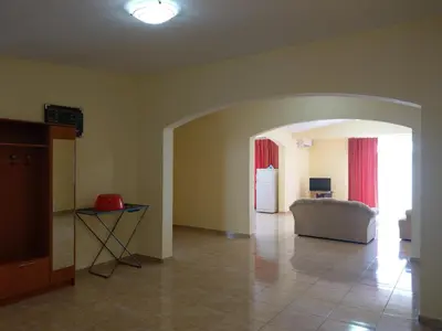 a living room with a couch and a refrigerator at Apartment Barski in Bar