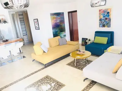 a living room with a couch and two chairs at Anatolia Luxury Seaview Residence in Becici