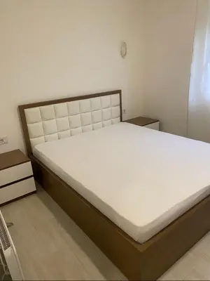 a bedroom with a large bed in a room at I&A Apartments in Ulcinj