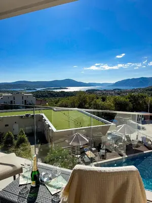 a view of a tennis court from the balcony of a house at SeaView Suite with Pool near Tivat Airport by Solea Vacation Homes in Tivat
