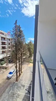 a view of a car parked on a street from a building at Tarik Apartment in Ulcinj