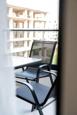 a table and chairs sitting on a balcony at Tarik Apartment in Ulcinj
