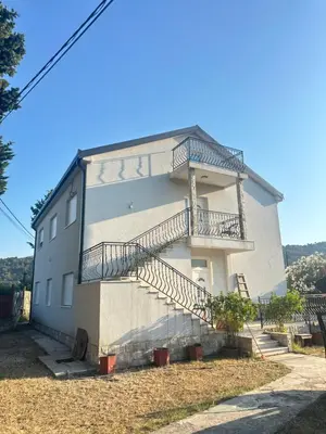 a building with stairs on the side of it at Vila Dusan in Bar