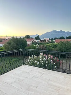 a balcony with a fence and flowers at Vila Dusan in Bar