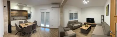 a living room with a couch and a table at Vila Dusan in Bar