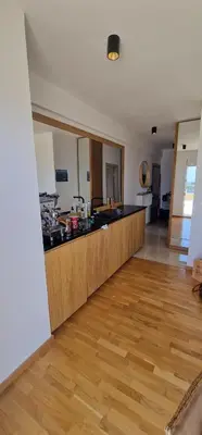 a kitchen with a counter top in a room at Penthouse Traumblick Bečići in Budva