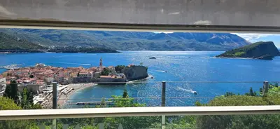 a view from a window of a town on a lake at Penthouse Traumblick Bečići in Budva