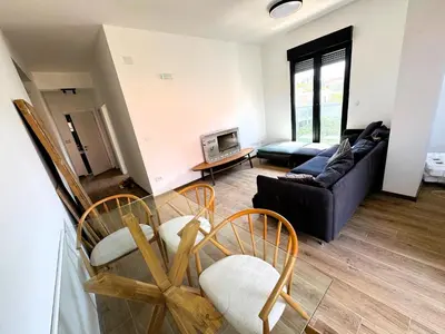 a living room with a couch and chairs at Florida Apartments in Dobra Voda
