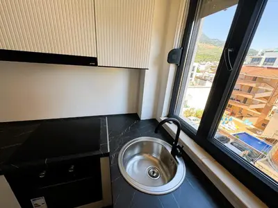 a silver sink in a room with a window at Florida Apartments in Dobra Voda