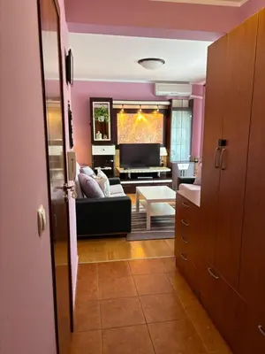 a living room with a couch and a tv at Njaro Del Mar 14 in Petrovac na Moru