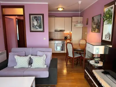 a living room with a couch and a table at Njaro Del Mar 14 in Petrovac na Moru