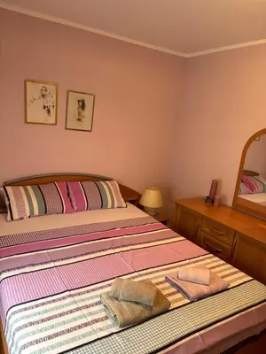 a bedroom with two beds and a mirror at Njaro Del Mar 14 in Petrovac na Moru