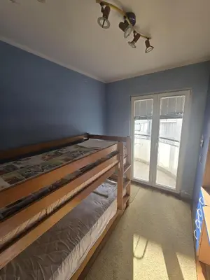 a bedroom with a bunk bed and a window at Apartman Orange Budva in Budva