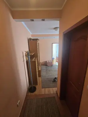 a room with a hallway with a door and a hall way at Apartman Orange Budva in Budva