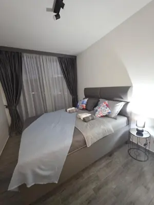 a bedroom with a large bed and a window at Villa Azzurra in Radanovići
