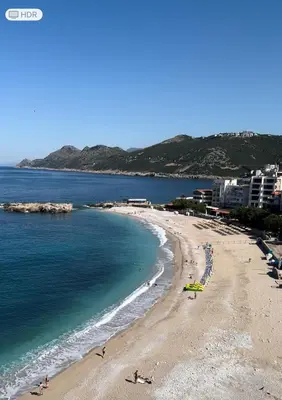 a view of a beach with people in the water at Apartments Sava in Dobra Voda