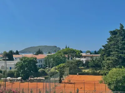 a view of a baseball field behind a fence at Comfort Apartments Balkan in Budva