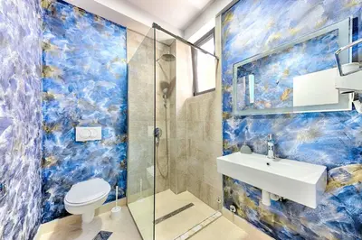 a bathroom with a toilet and a sink and a shower at Lotos - apart 207 L1 in Dobra Voda