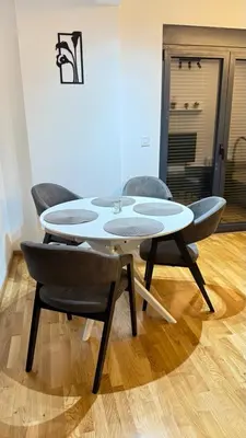 a table and chairs in a room at Comfort in Bar