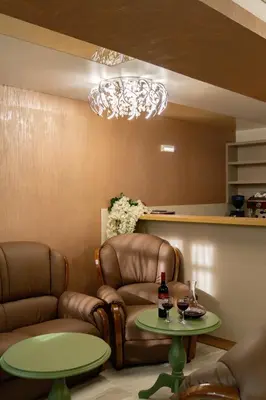 a waiting room with two chairs and a table at Residence Tommy in Budva