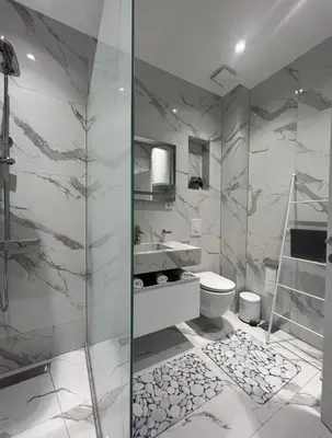 a bathroom with a shower and a sink and a toilet at Luxury Apartment With Sea View in Ulcinj