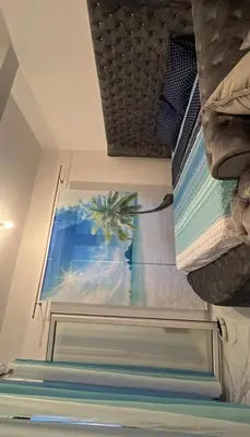 a view of a window in a room with a bed at Luxury Apartment With Sea View in Ulcinj