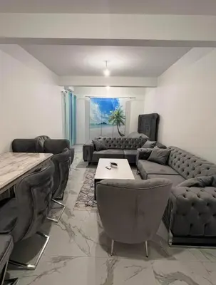 a living room with a couch and a table at Luxury Apartment With Sea View in Ulcinj