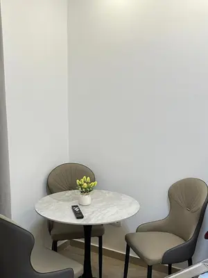 a table and chairs in a waiting room at Garsonjera u centru Budve in Budva
