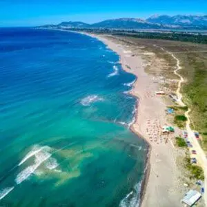 an aerial view of a beach with people on it at Cama Apartmani in Donji Štoj
