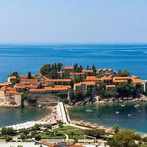 a town on the shore of a body of water at Cama Apartmani in Donji Štoj