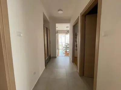 a hallway of a house with a hallway at Apartman Zlatni dan - zgrada Idea - Bečići in Becici