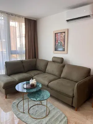 a living room with a couch and a table at Apartmani Vanity Budva in Budva