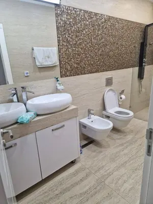 a bathroom with a sink and a toilet and a mirror at Apartment Matej 2 in Budva